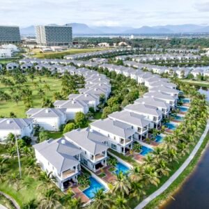Stunning aerial image showcasing luxury villas with private pools at a resort in Vietnam.